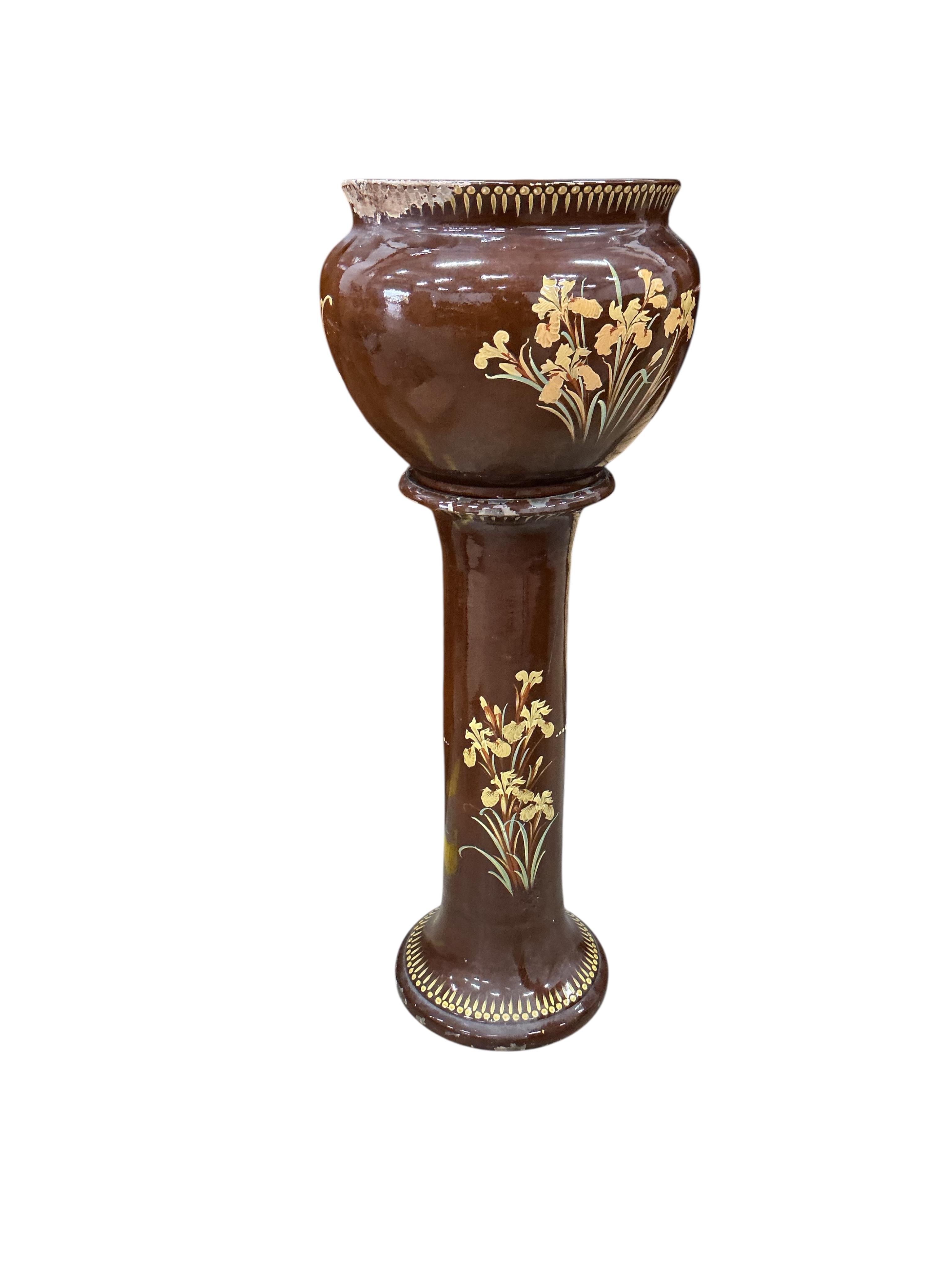 A Victorian glazed earthenware jardiniere on stand, diameter 44cm, height 108cm